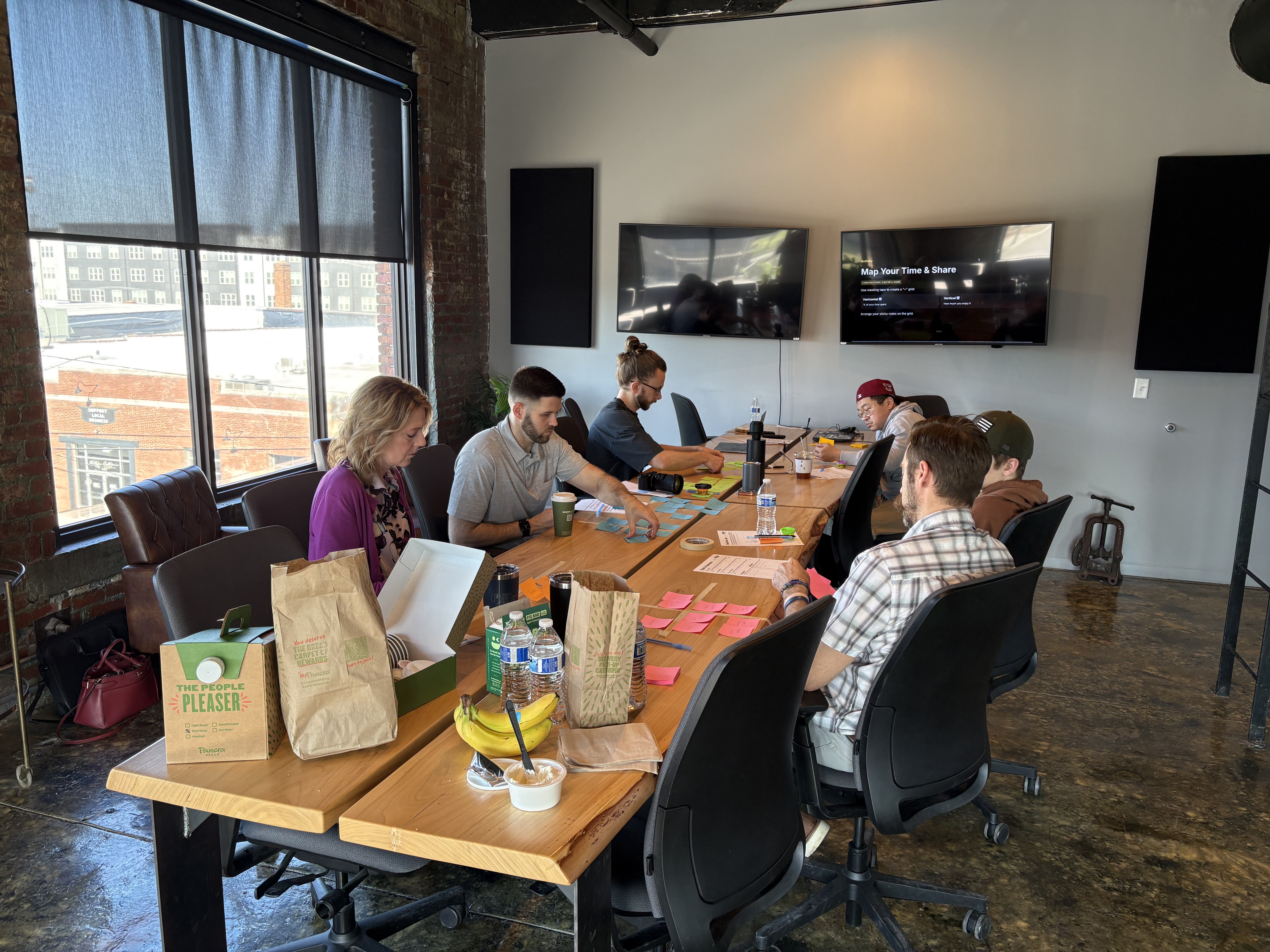 Business owners collaborating at a hands-on AI workshop